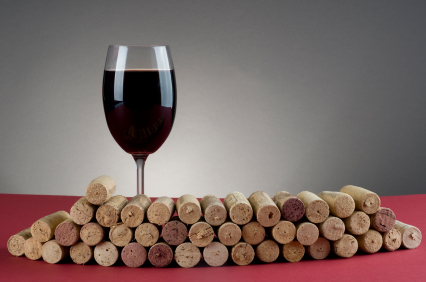 A picture of wine and some corks