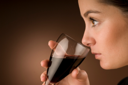 Woman smelling wine