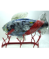 Calera Anejo tequila Fish on metal stand